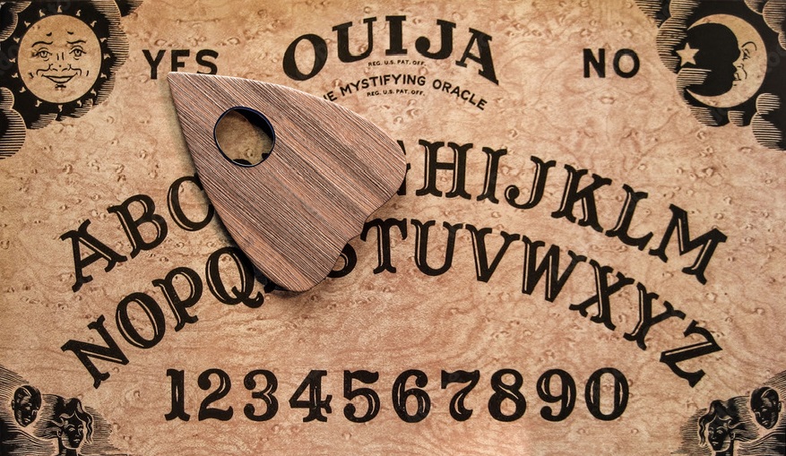 A wooden board with numbers and a wooden object

Description automatically generated