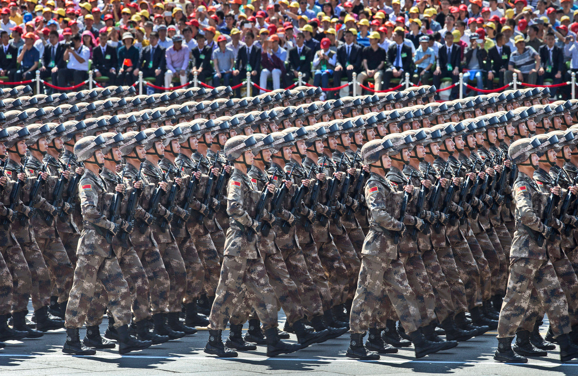 A group of soldiers marching in formation

Description automatically generated