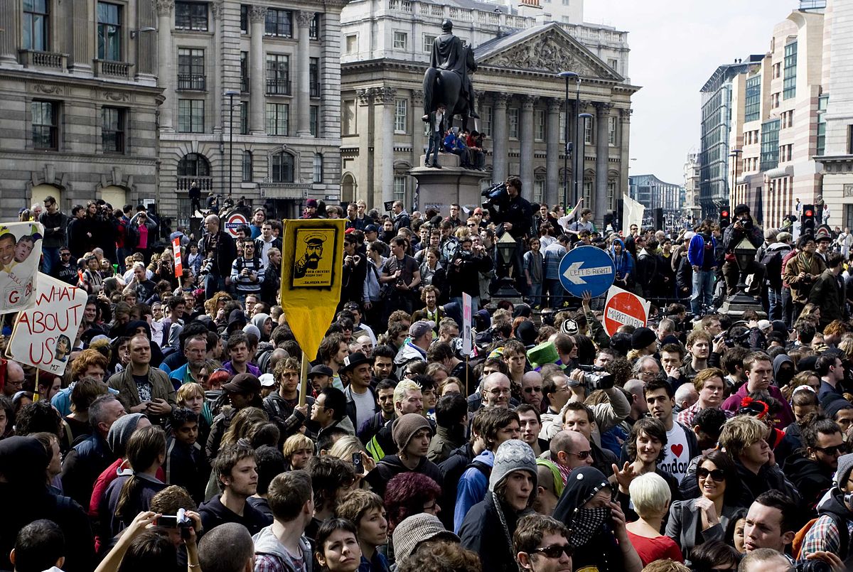 A large crowd of people in turmoil in the street